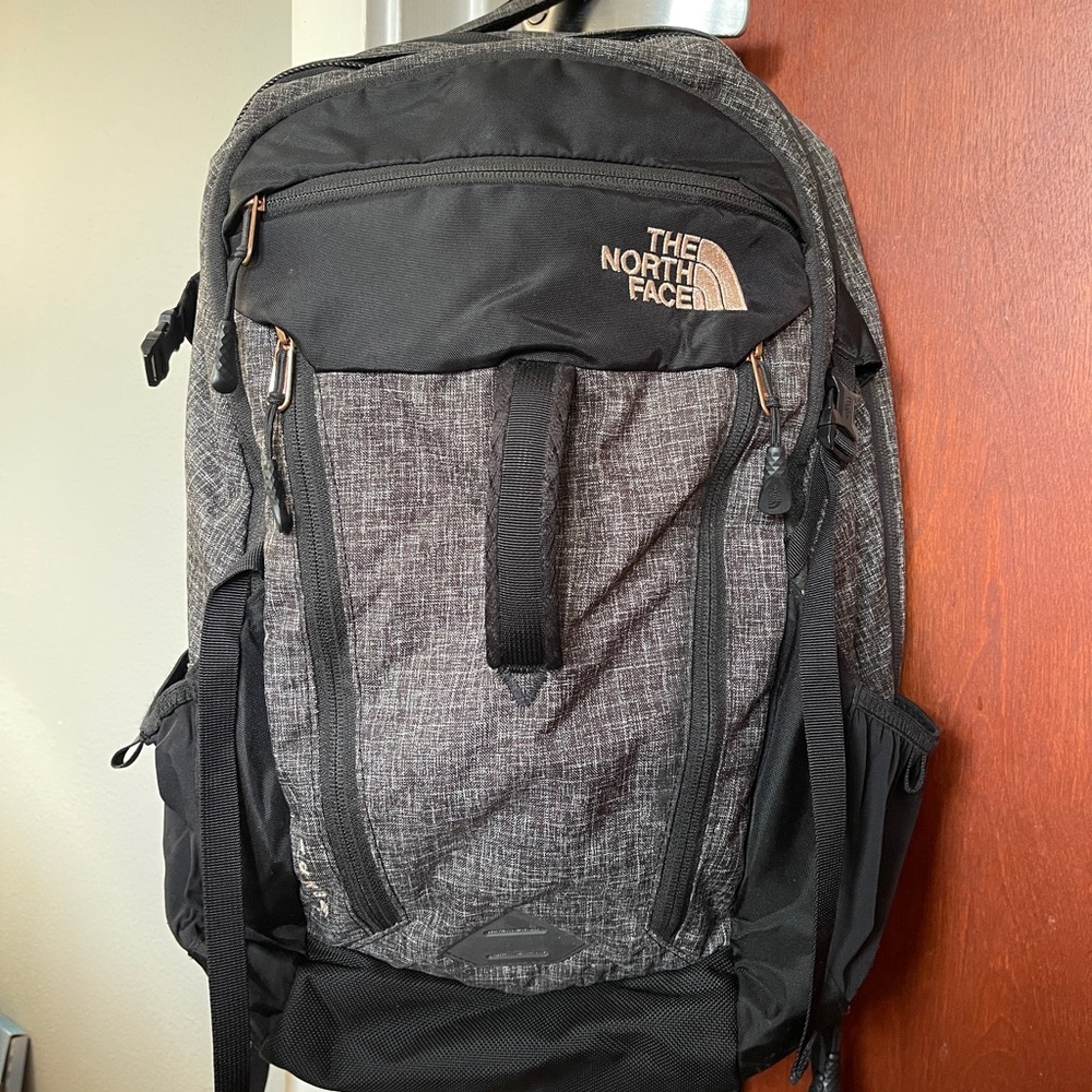 The North Face Surge Black and Gray Backpack with Rose Gold details and Zippers